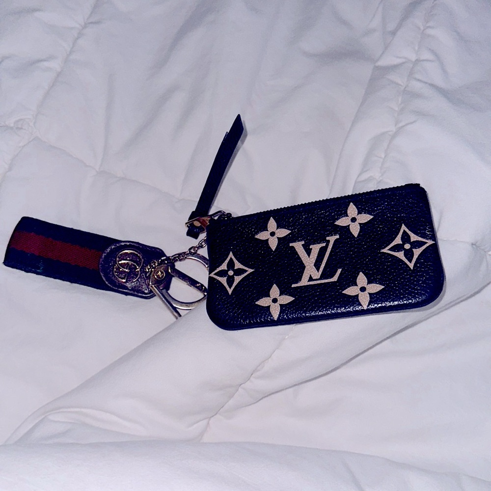 Louis Vuitton wallet and Gucci key chain. Both in great shape and perfect!